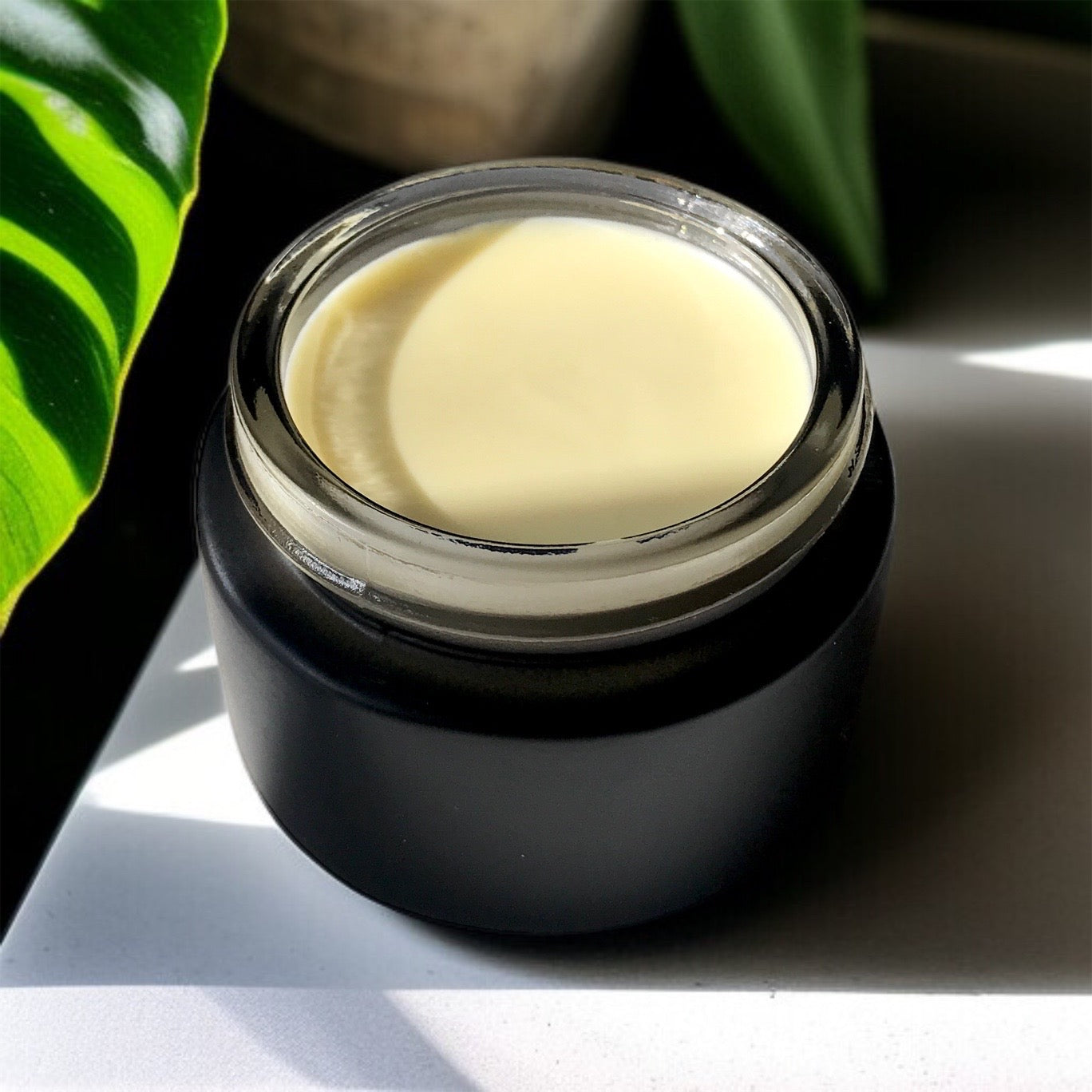 banana barrier cream in black jar