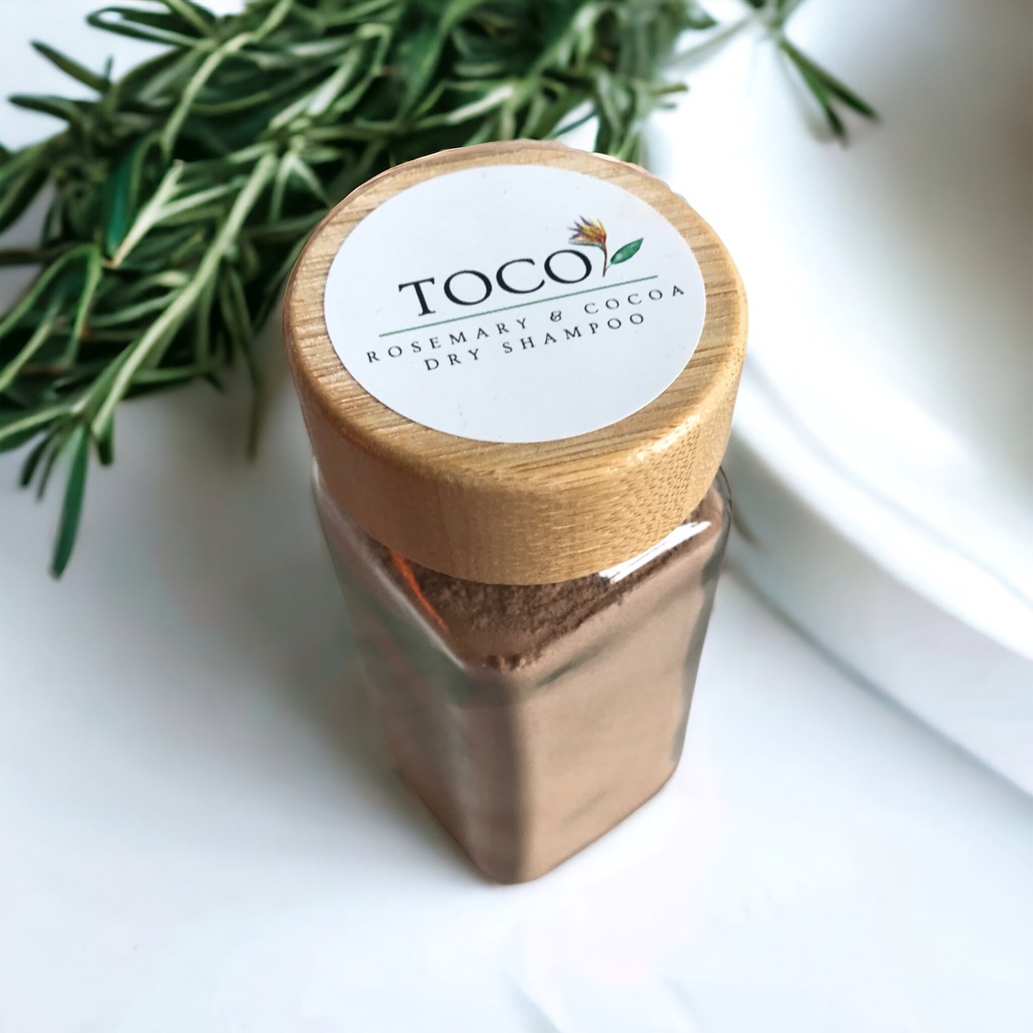 4oz glass jar with rosemary & cocoa dry shampoo