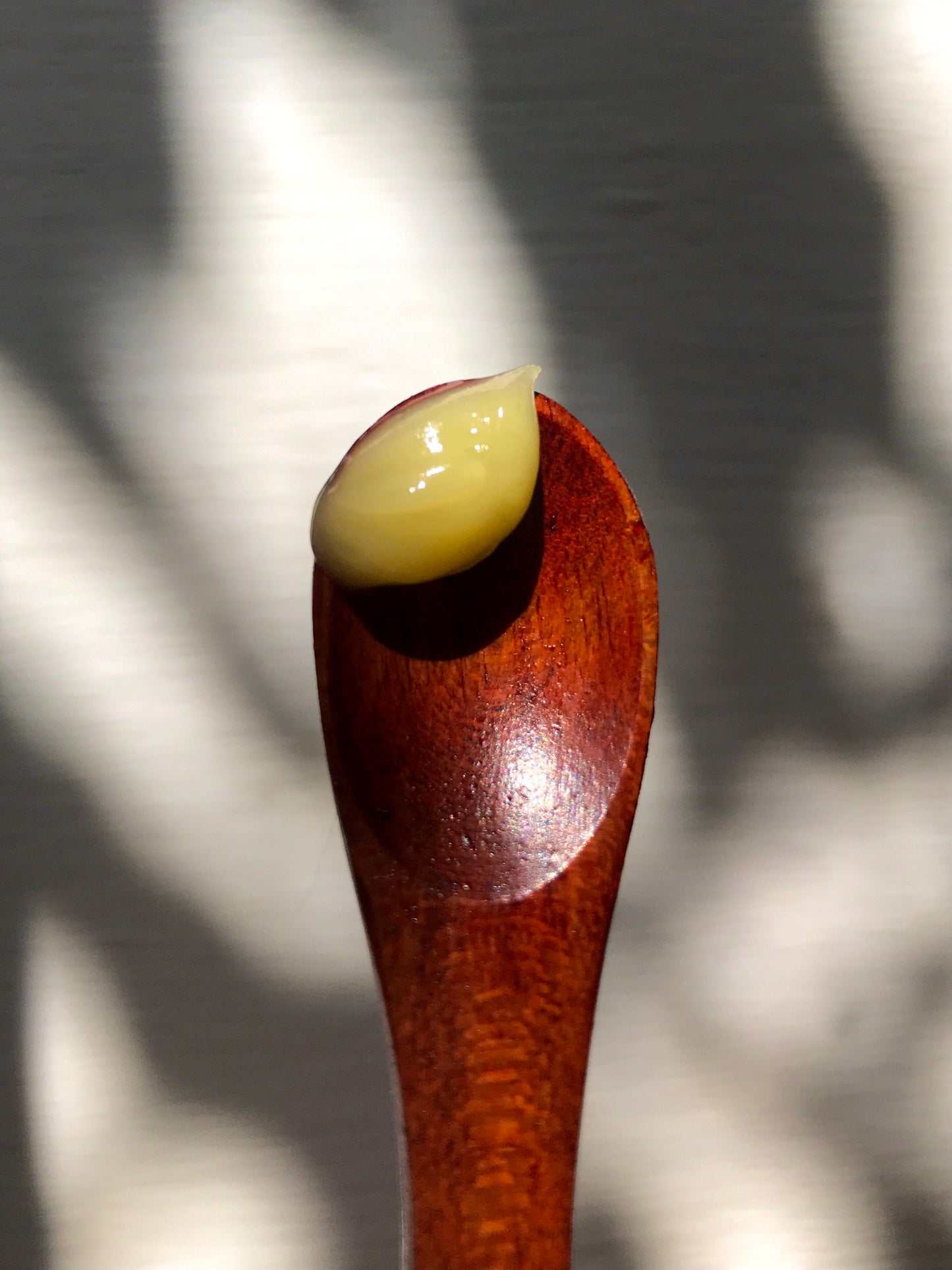 wooden spoon with a scoop of hibiscus night renewal