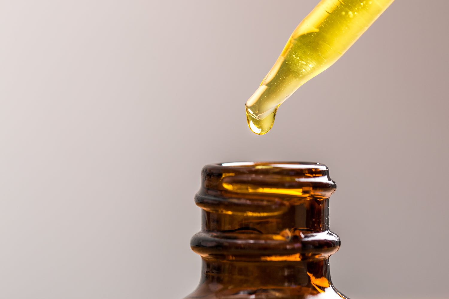 glass bottle with dropper of oil