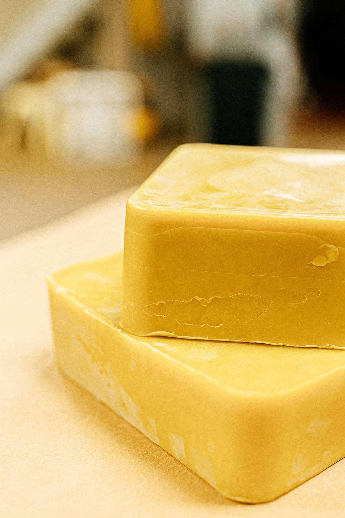two bars of yellow beeswax