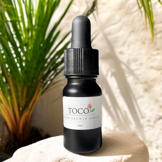10 ml black glass bottle and dropper with brow growth serum in sunlight