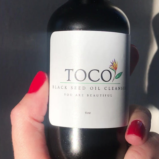 Black seed oil cleanser in black bottle